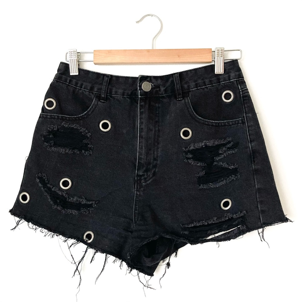 Distressed black denim shorts with rivets